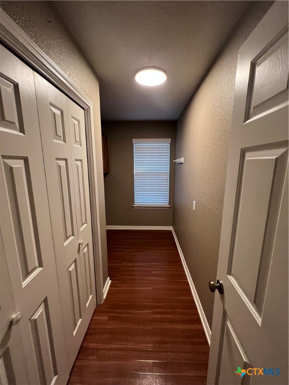 1241 Rapids Road New Braunfels, TX 78130 - Photo 12 of 27 a view of a hallway with wooden floor and staircase