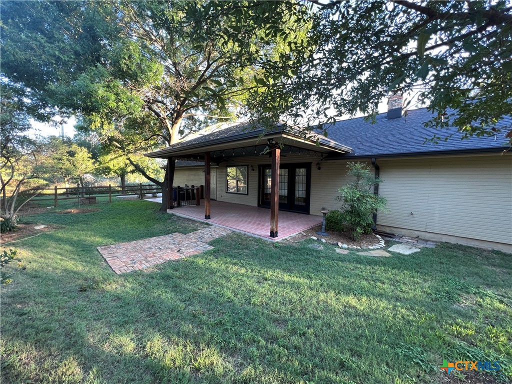 1241 Rapids Road New Braunfels, TX 78130 - Photo 27 of 27 a front view of a house with garden