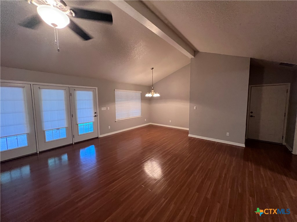 1241 Rapids Road New Braunfels, TX 78130 - Photo 10 of 27 a view of an empty room with wooden floor and a window
