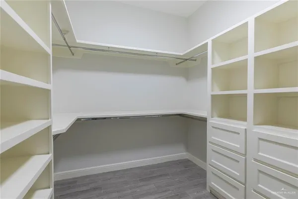 a view of an empty walk in closet