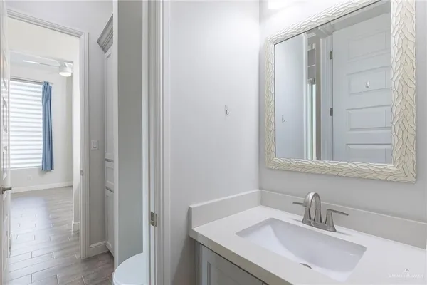 a bathroom with a sink and a mirror