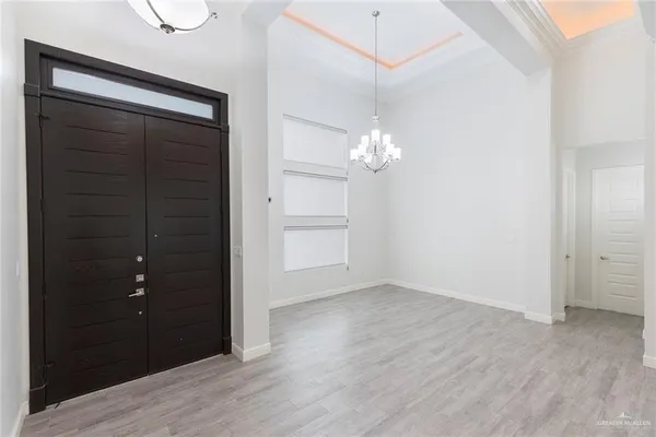 wooden floor in an empty room with a mirror