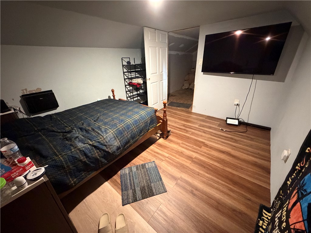 302 Sirrine Street Honea Path, SC 29654 - Photo 21 of 24 Functional bedroom with durable wood flooring and ample space for a bed and entertainment.