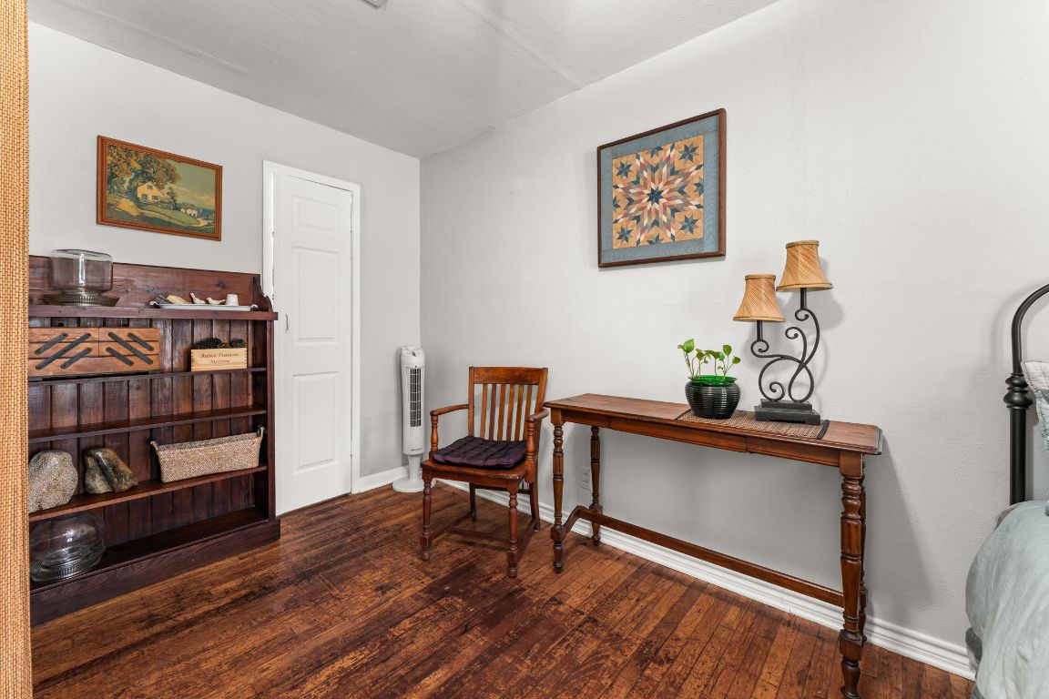 1303 Alegria Road Austin, TX 78757 - Photo 17 of 25 a view of a workspace with furniture and wooden floor