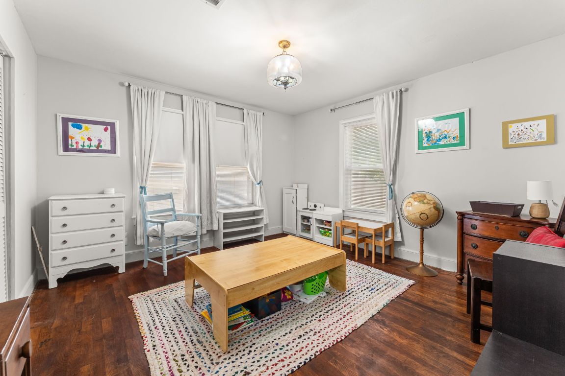 1303 Alegria Road Austin, TX 78757 - Photo 19 of 25 a living room with furniture and wooden floor