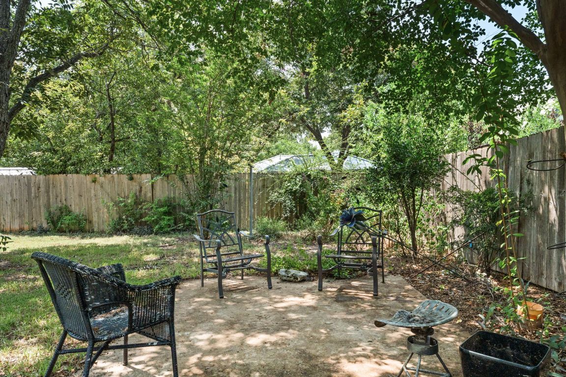 1303 Alegria Road Austin, TX 78757 - Photo 22 of 25 a view of a chairs and table in the backyard