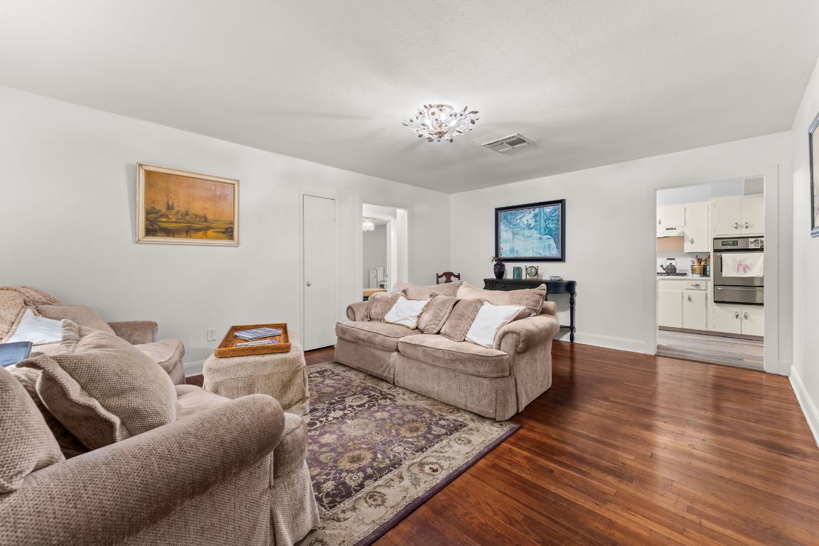 1303 Alegria Road Austin, TX 78757 - Photo 4 of 25 a living room with furniture and wooden floor