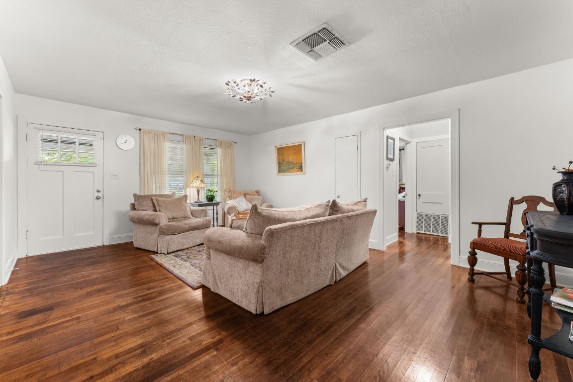 1303 Alegria Road Austin, TX 78757 - Photo 5 of 25 a living room with furniture and a wooden floor