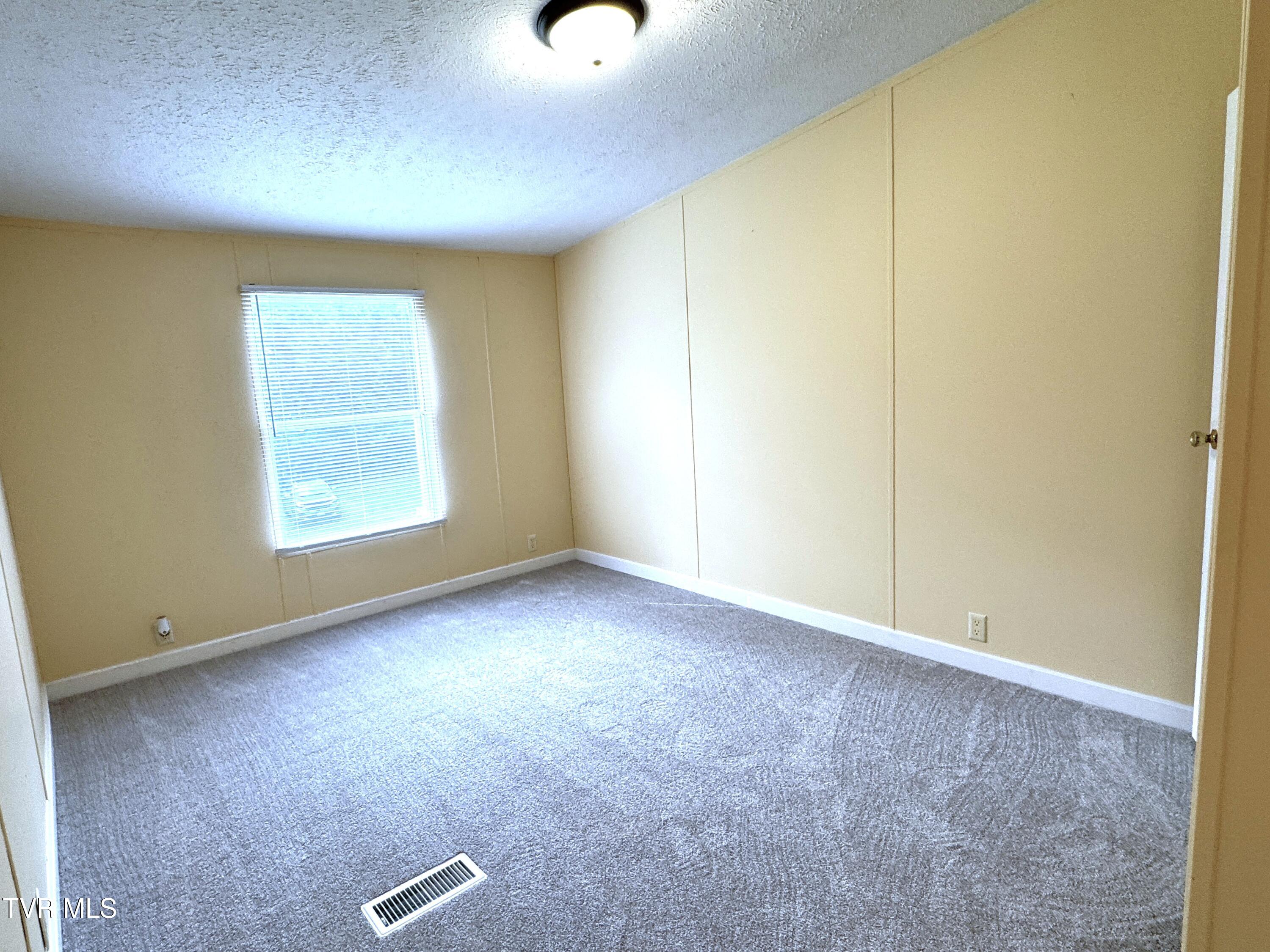 1555 Hamner Hollow Road Big Stone Gap, VA 24219 - Photo 31 of 41 BEDROOM 3 TOWARD WINDOW
