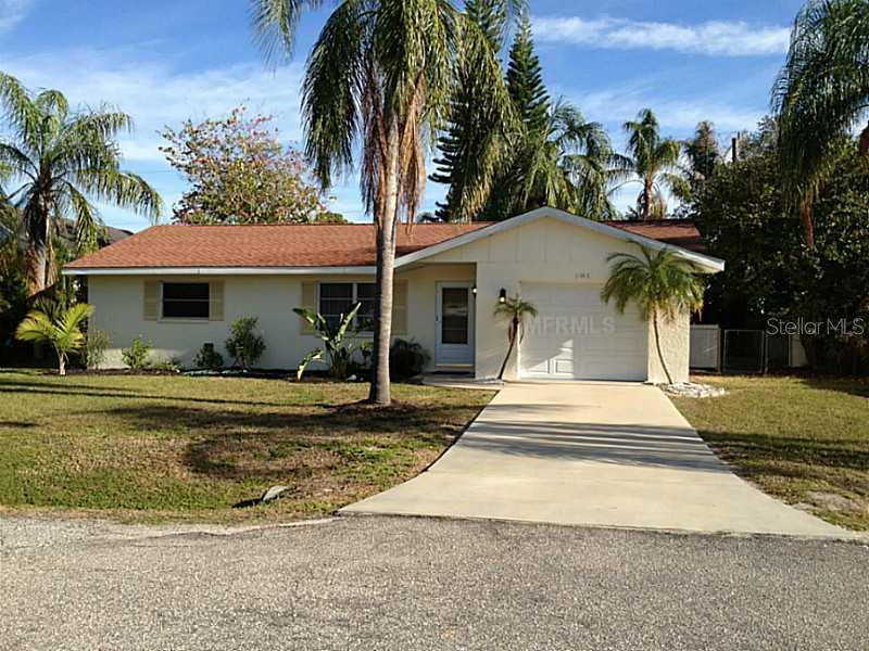 984 Panda Road Venice, FL 34293 - Photo 1 of 1 a view of a house with a yard and palm trees