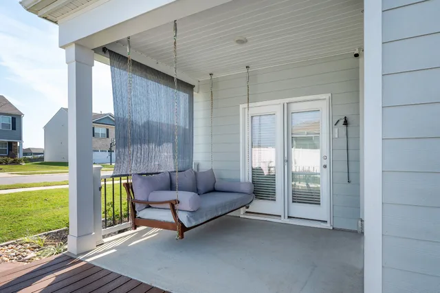 a view of patio with a table and chairs under an umbrella