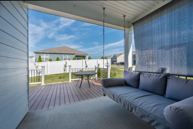 a view of a balcony with wooden floor