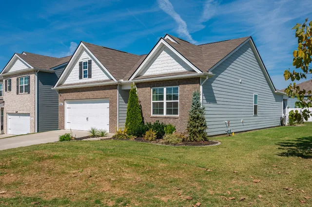 a front view of a house with garden