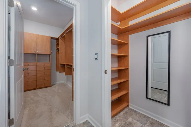 a view of closet area with empty racks