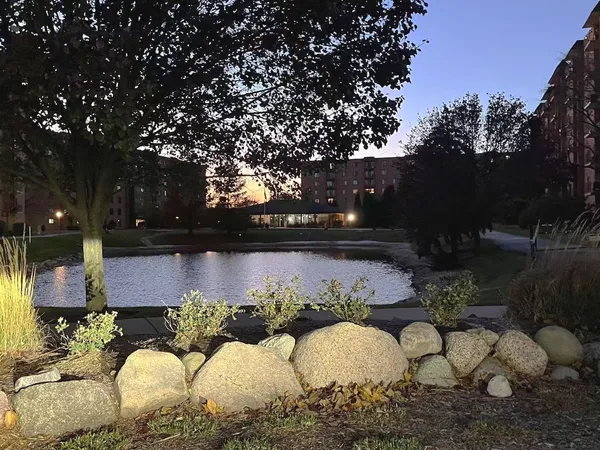 a swimming pool with outdoor seating and yard