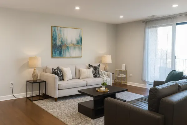 a living room with furniture and a large window