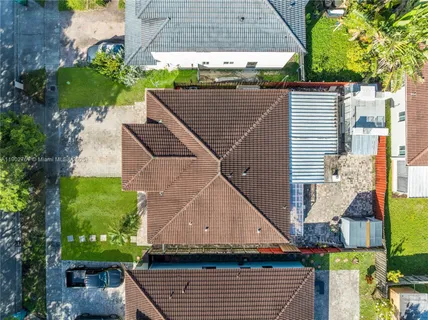 a aerial view of a house with a yard