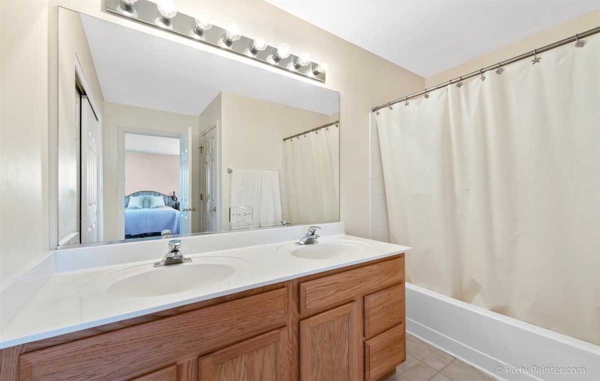 243 Grand Ridge Road St. Charles, IL 60175 - Photo 19 of 29 a bathroom with a double vanity sink and a mirror