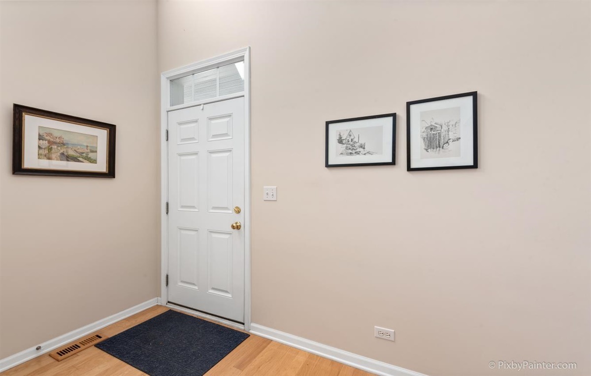 243 Grand Ridge Road St. Charles, IL 60175 - Photo 3 of 29 a view of a hallway with wooden floor