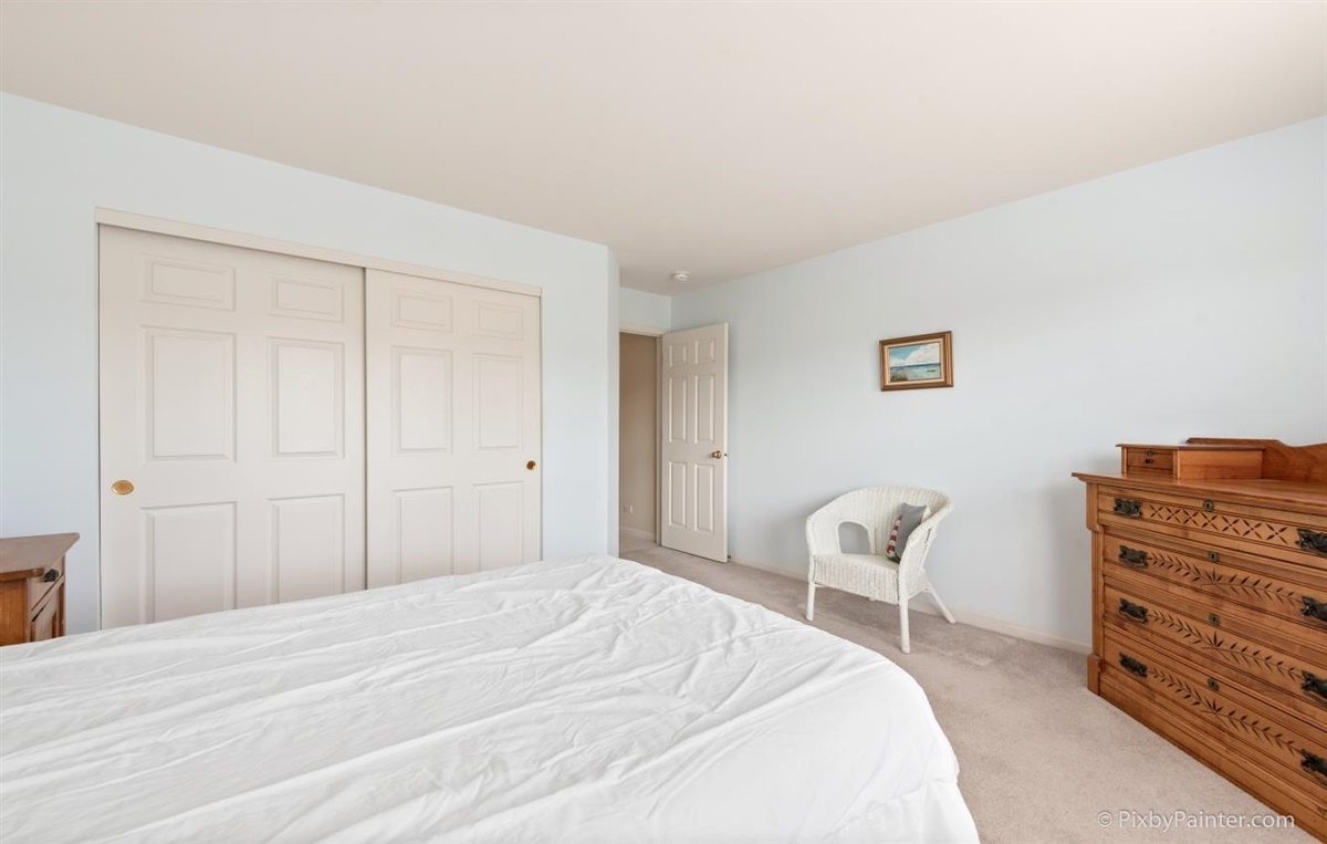 243 Grand Ridge Road St. Charles, IL 60175 - Photo 21 of 29 a bedroom with a bed and chair