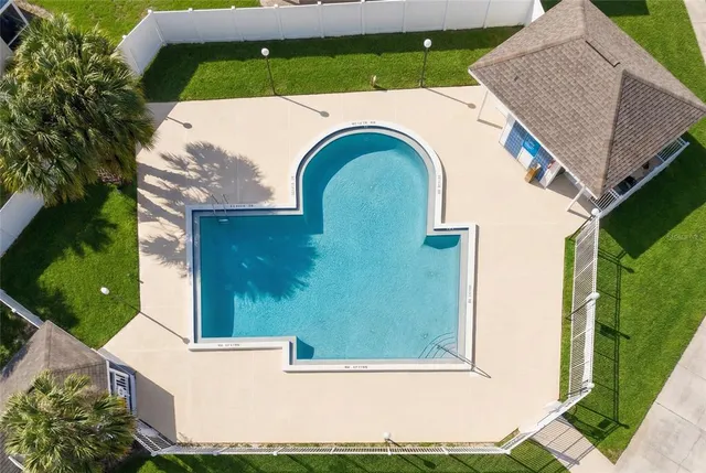 aerial view of a house with a yard