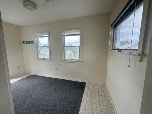 a view of empty room with windows