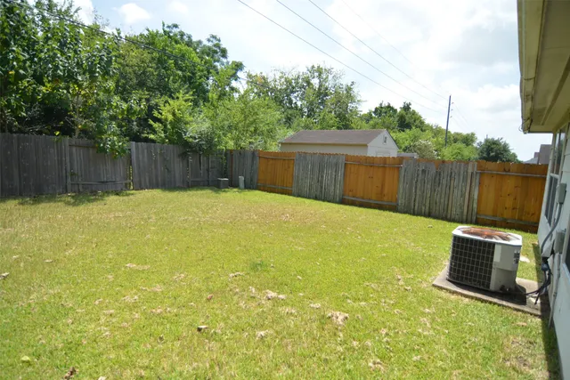 a swimming pool with wooden fence