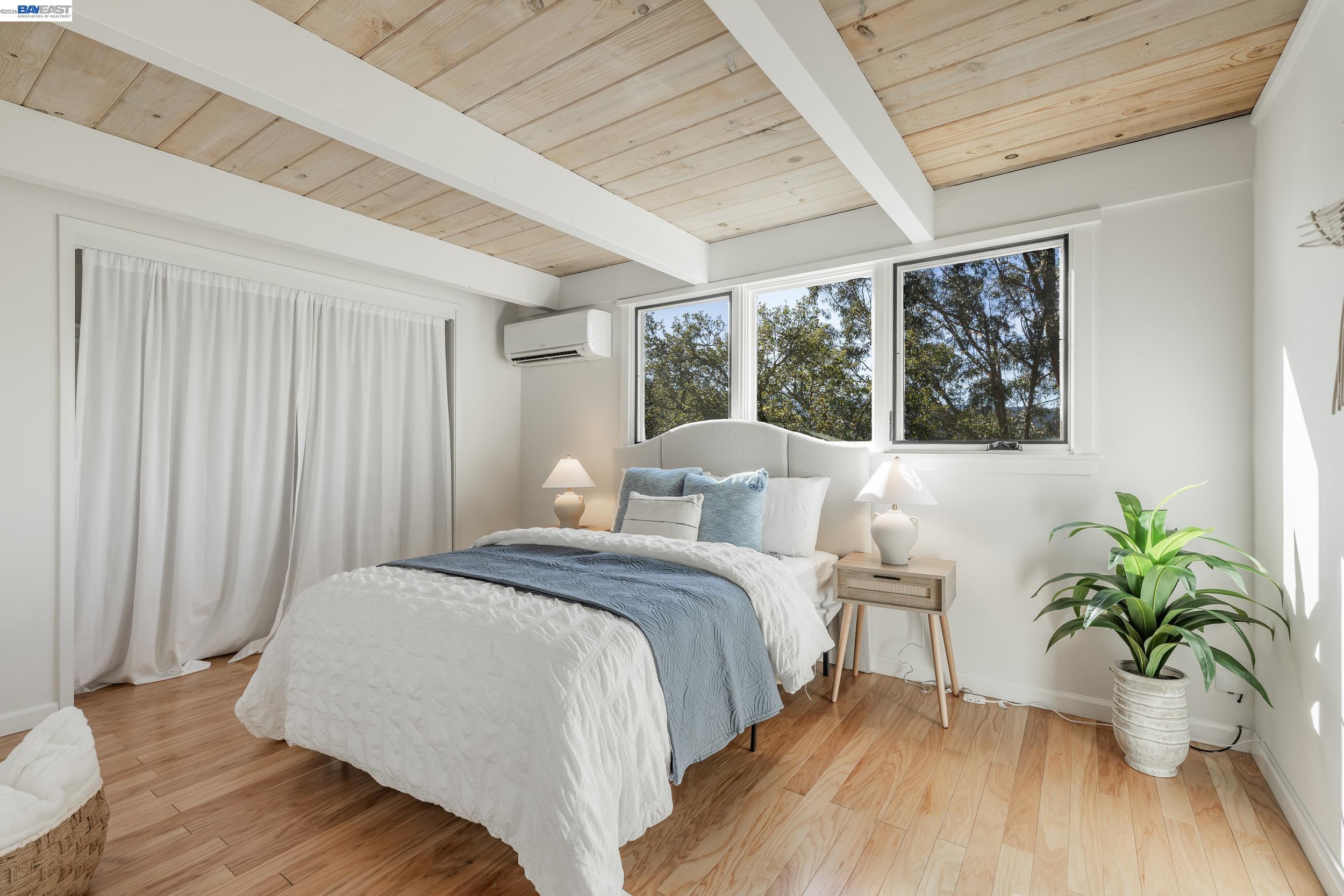 148 Ridgeway Avenue Fairfax, CA 94930 - Photo 11 of 31 a bed sitting in a spacious bedroom next to a window