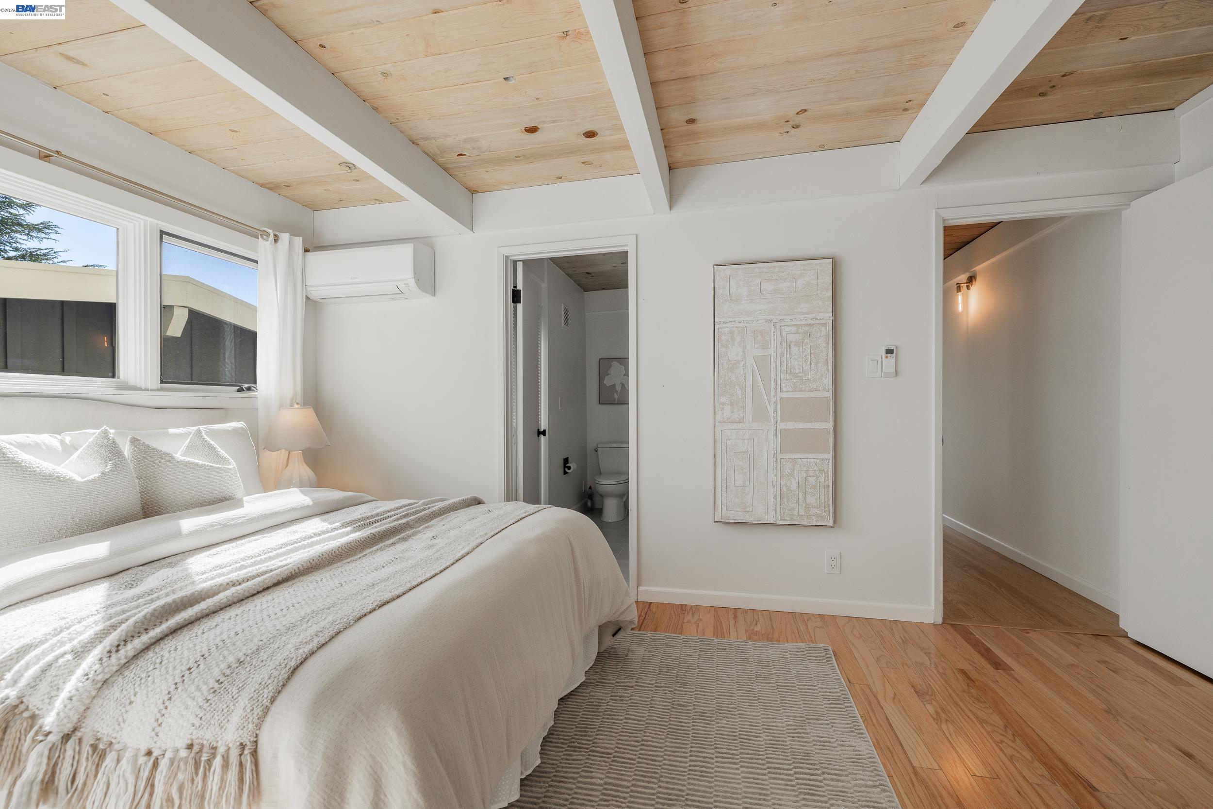 148 Ridgeway Avenue Fairfax, CA 94930 - Photo 15 of 31 a bedroom with a large bed and a window