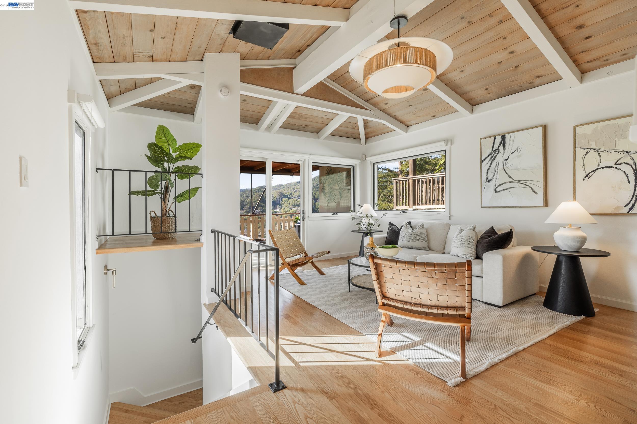 148 Ridgeway Avenue Fairfax, CA 94930 - Photo 9 of 31 a living room with fireplace furniture and a chandelier