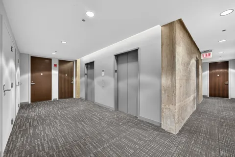 a view of entryway with wooden floor