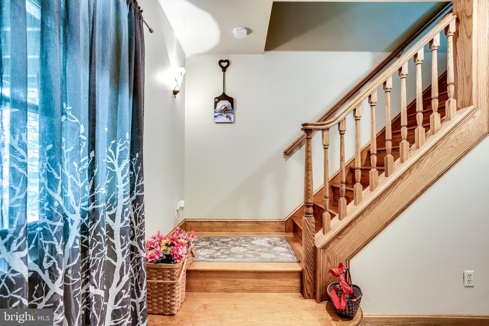 3784 Roop Road New Windsor, MD 21776 - Photo 23 of 49 Oak staircase to lower level