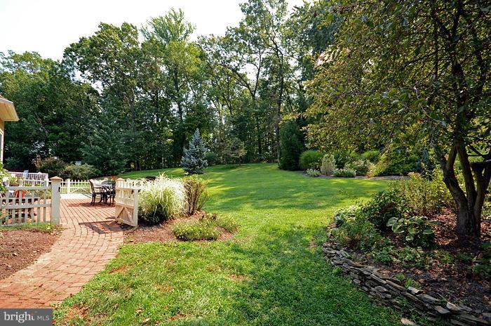 18600 Gunpowder Road Hampstead, MD 21074 - Photo 8 of 21 a view of a backyard with a bench