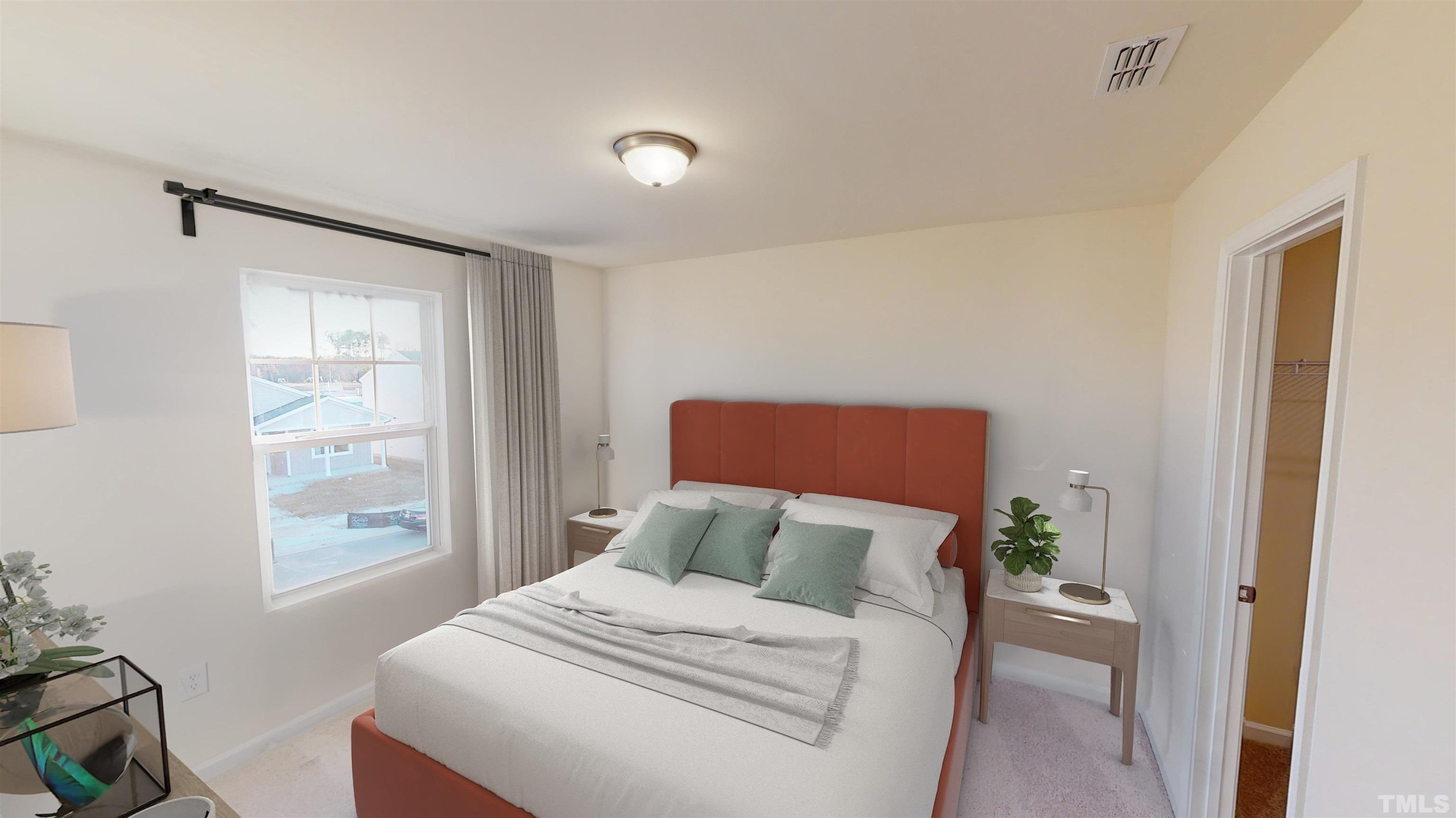 3517 Dragonfly River Raleigh, NC 27604 - Photo 22 of 27 a bedroom with a large bed and a window