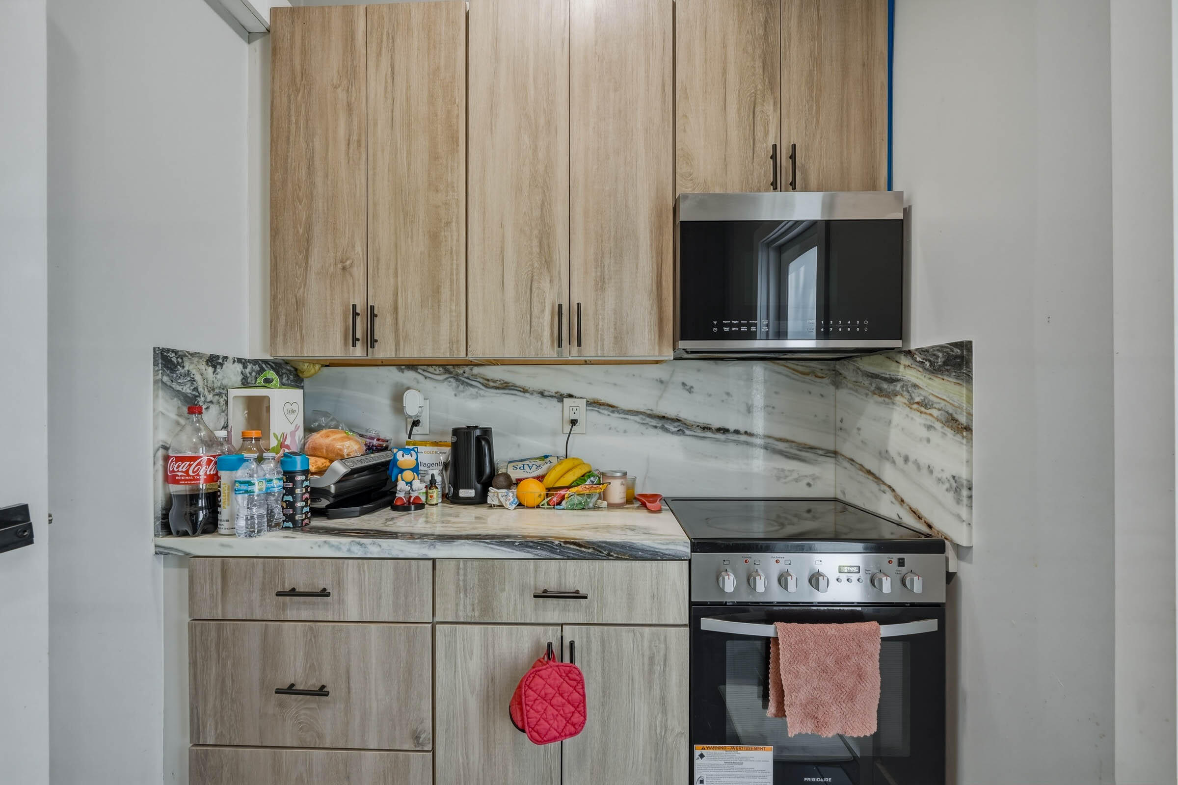 2805 Flagler Avenue Key West, FL 33040 - Photo 14 of 53 a kitchen with stainless steel appliances granite countertop a sink stove and cabinets