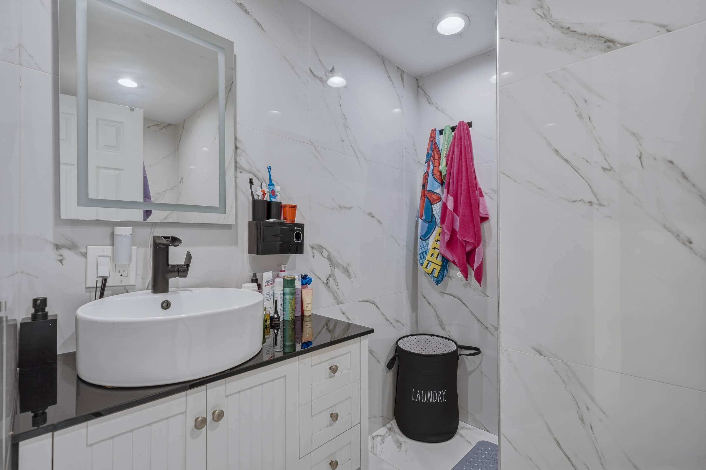 2805 Flagler Avenue Key West, FL 33040 - Photo 19 of 53 a bathroom with a sink and mirror