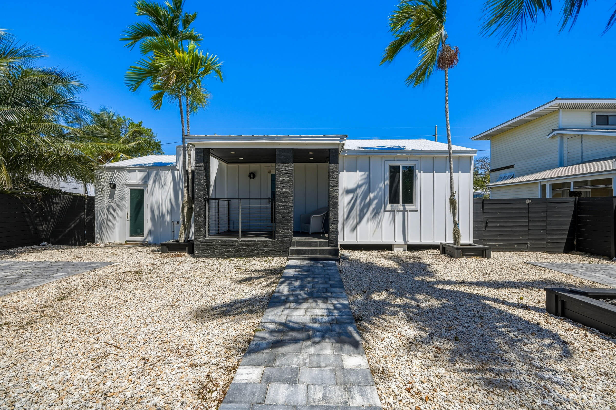 2805 Flagler Avenue Key West, FL 33040 - Photo 2 of 53 a front view of a house with a yard and garage