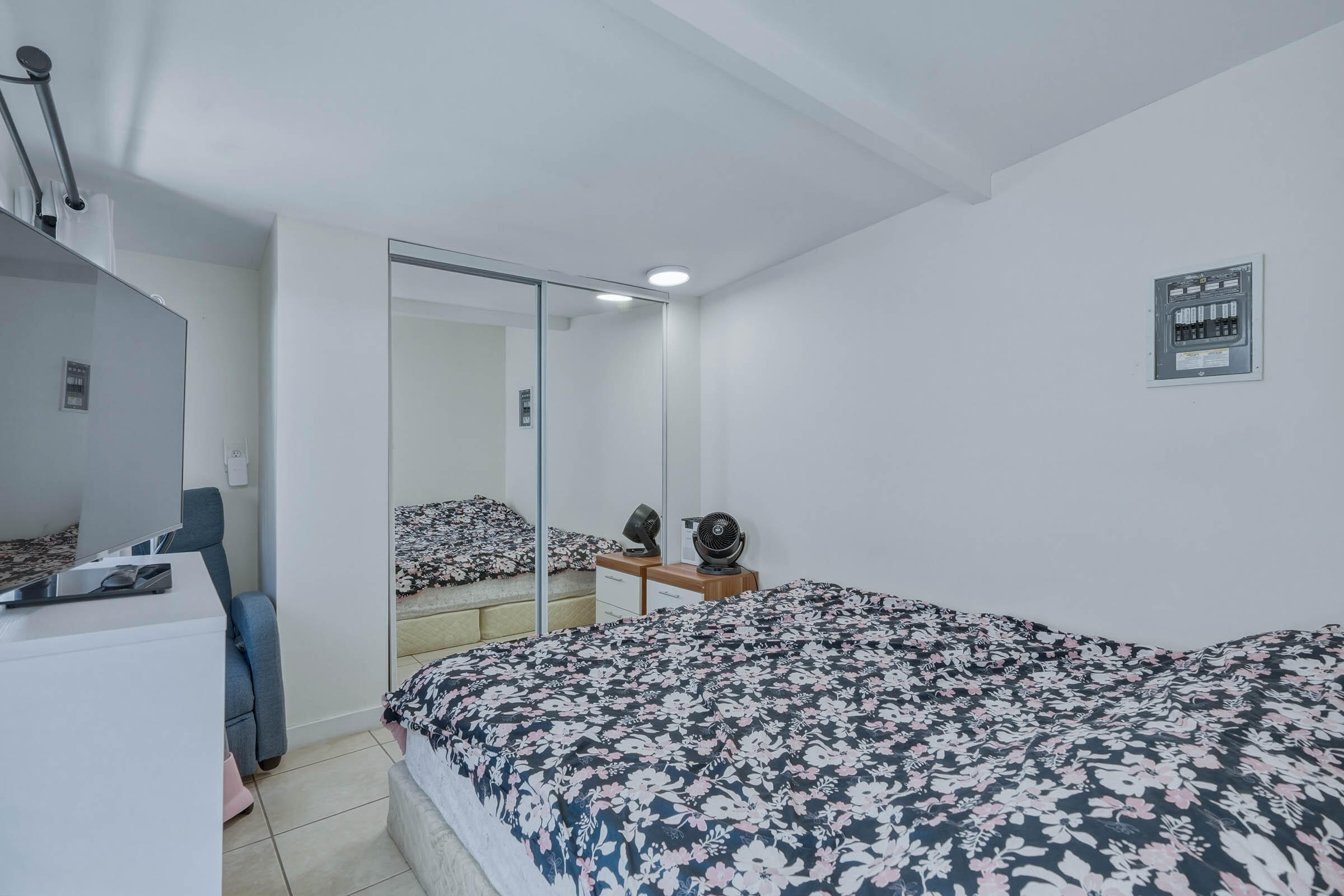 2805 Flagler Avenue Key West, FL 33040 - Photo 21 of 53 a bedroom with bed and chair