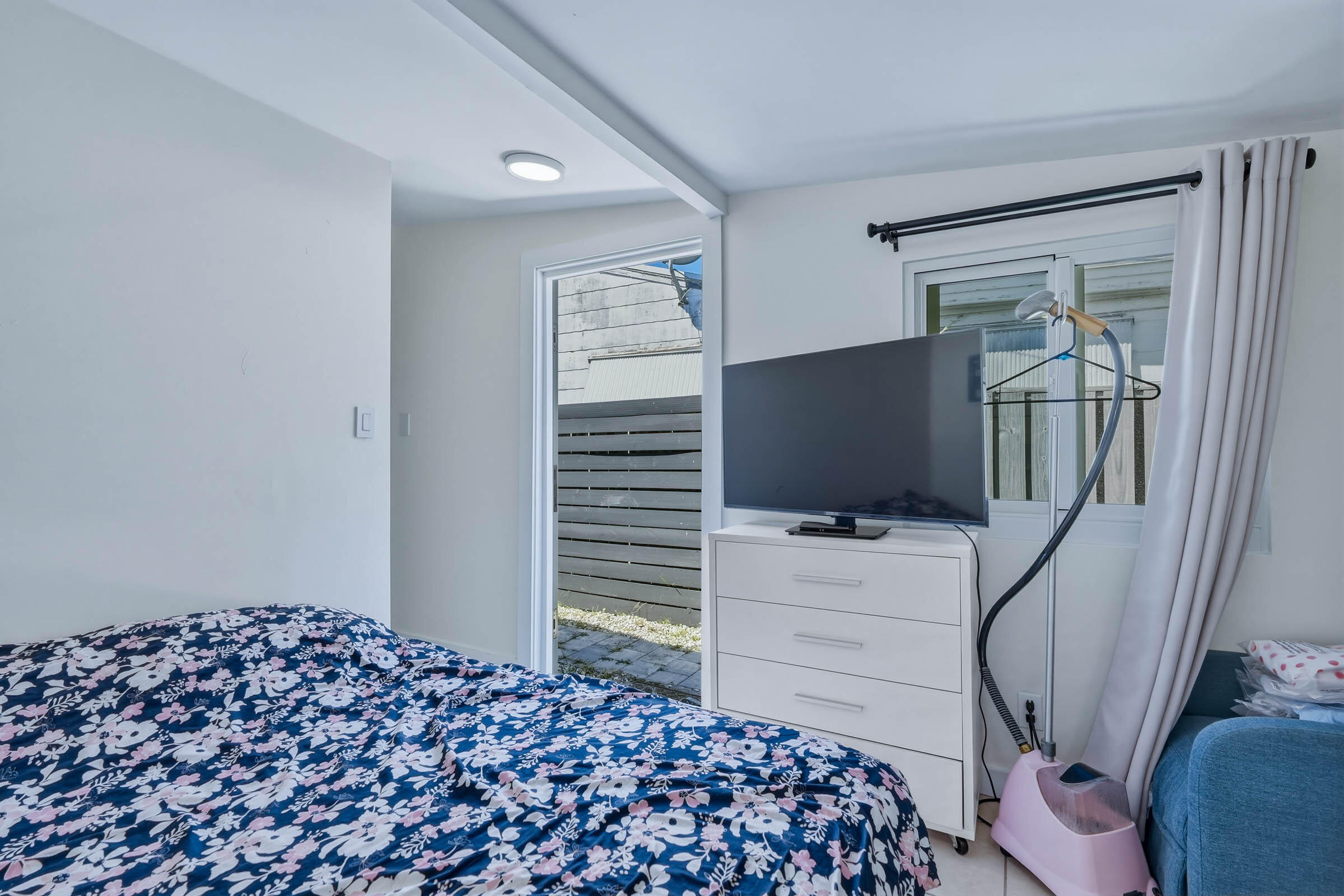 2805 Flagler Avenue Key West, FL 33040 - Photo 22 of 53 a bedroom with a bed and flat screen tv