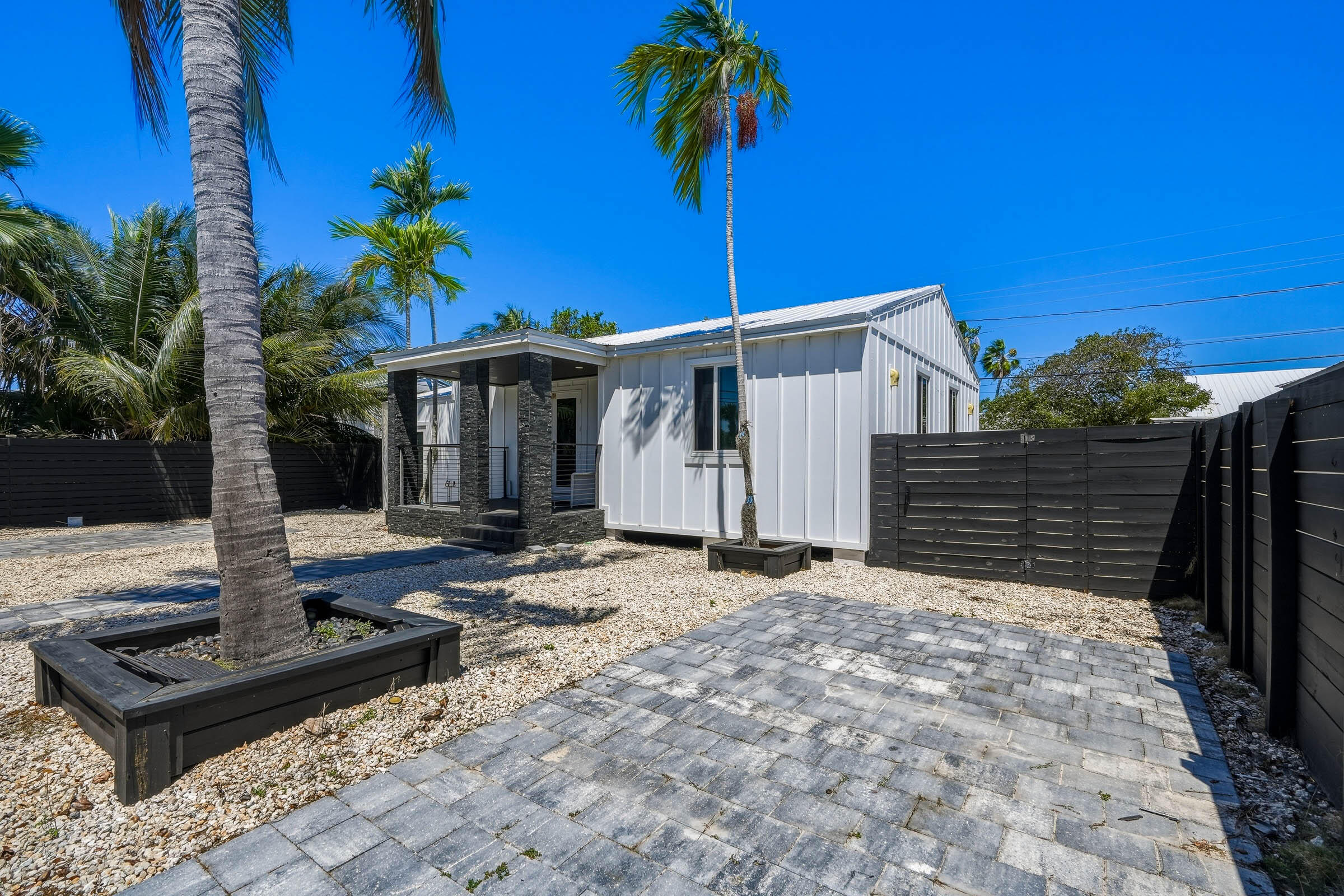 2805 Flagler Avenue Key West, FL 33040 - Photo 3 of 53 a front view of a house with garden