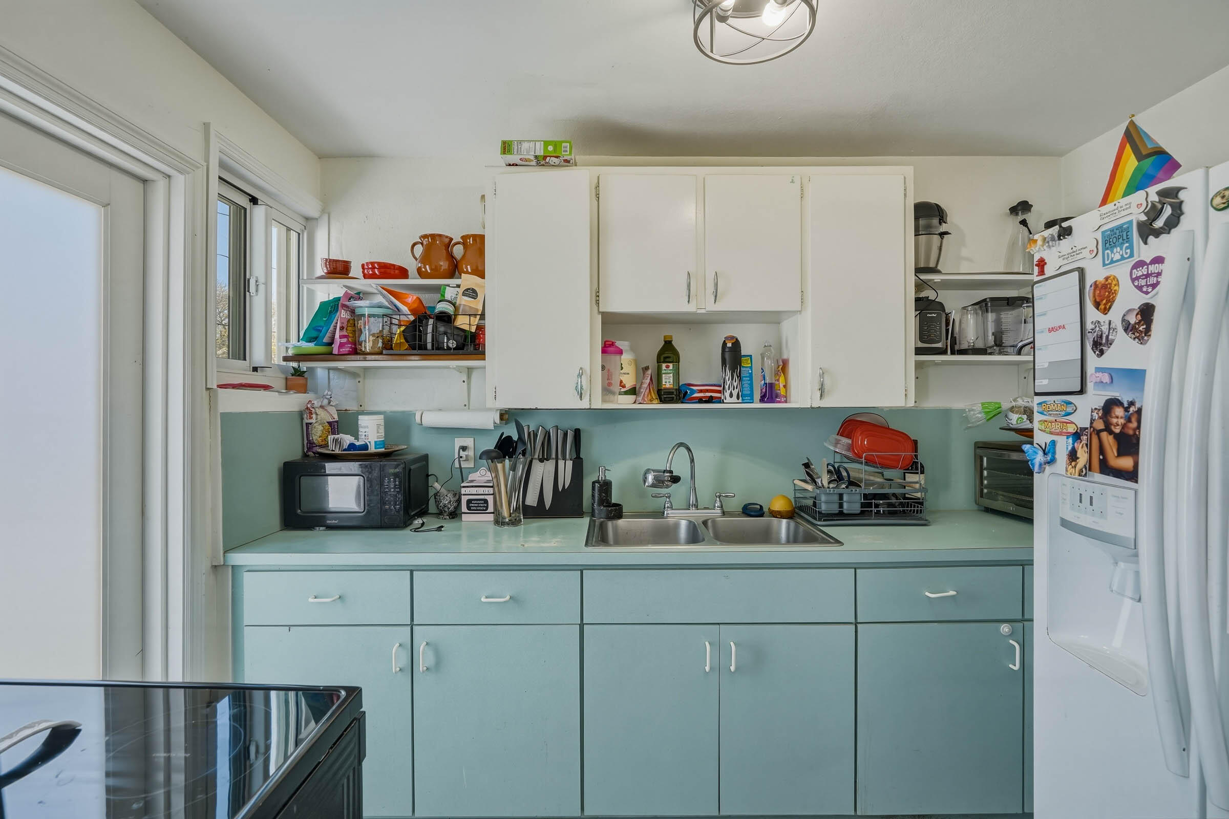 2805 Flagler Avenue Key West, FL 33040 - Photo 33 of 53 a kitchen with a refrigerator and cabinets