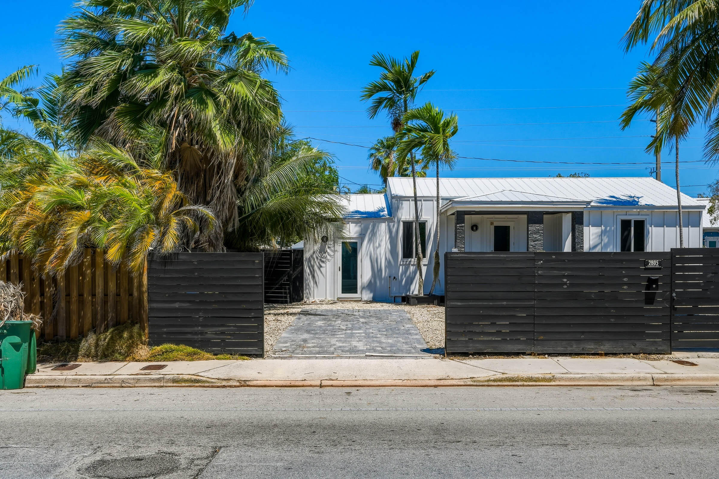 2805 Flagler Avenue Key West, FL 33040 - Photo 9 of 53 a front view of a house with a yard and garage