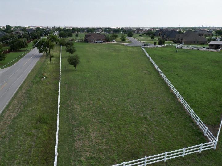 a view of a green field with clear sky