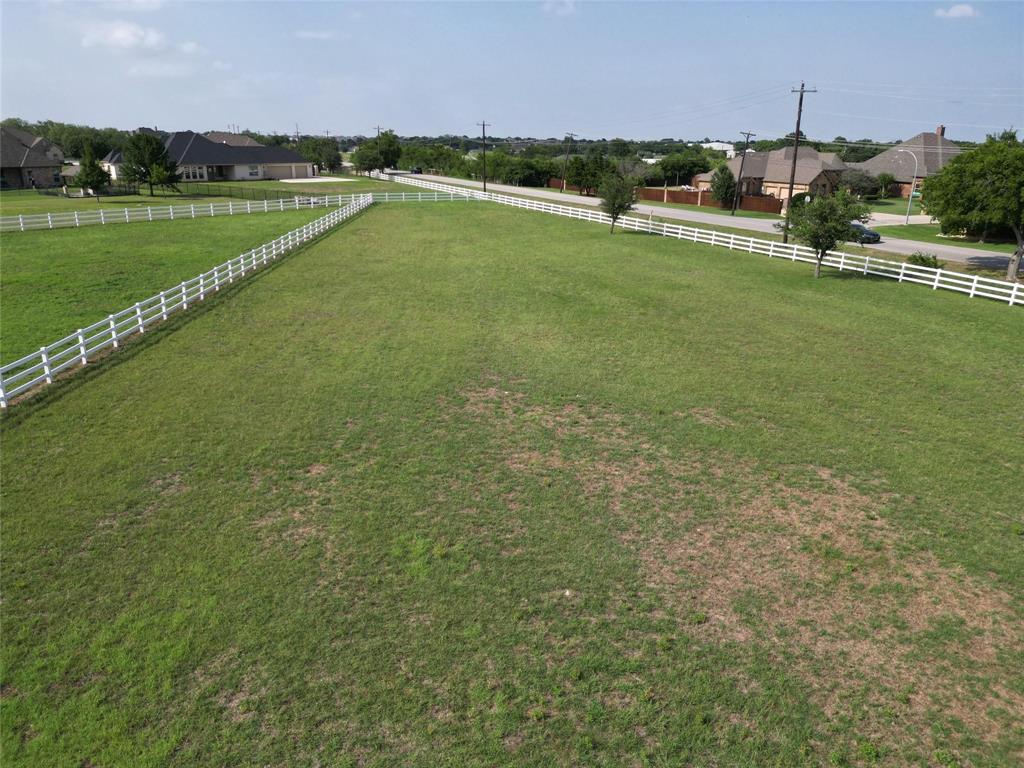 12916 Whisper Willows Court Fort Worth, TX 76052 - Photo 6 of 11 a view of a lake with a yard