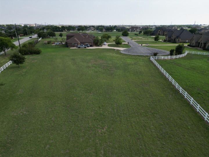 12916 Whisper Willows Court Fort Worth, TX 76052 - Photo 8 of 11 an aerial view of residential houses with outdoor space and trees