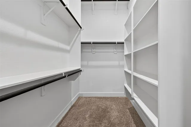 a view of an empty walk in closet