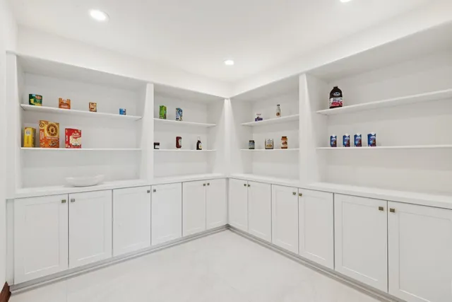 a living room with a window and dining table