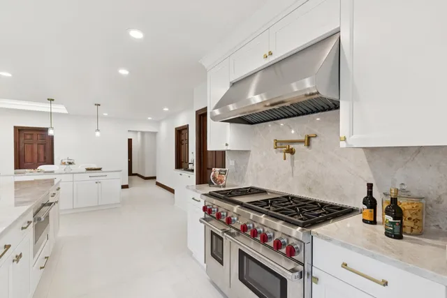 a bathroom with a toilet a sink a mirror and a shower