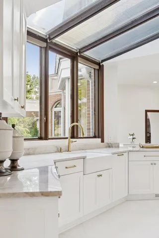 a living room with furniture and a ceiling fan