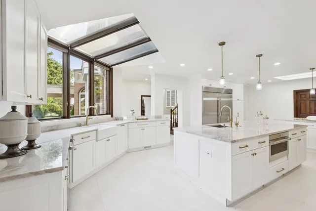 a view of a livingroom with a fireplace cabinet and a window